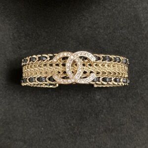 CHANEL Gold and Black Interwoven Bracelet